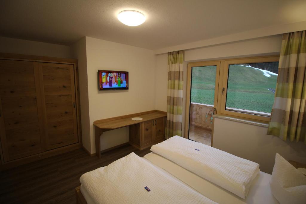 Postel nebo postele na pokoji v ubytování Apart Geisler