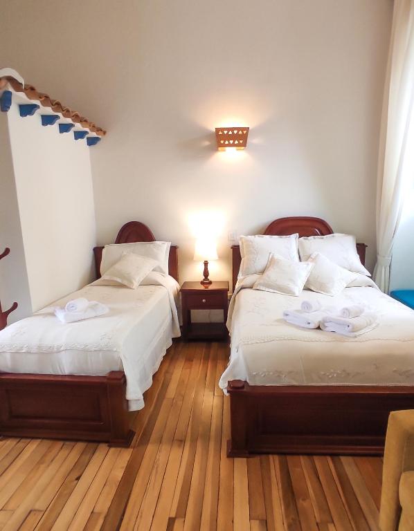 Postel nebo postele na pokoji v ubytování Casona 1865