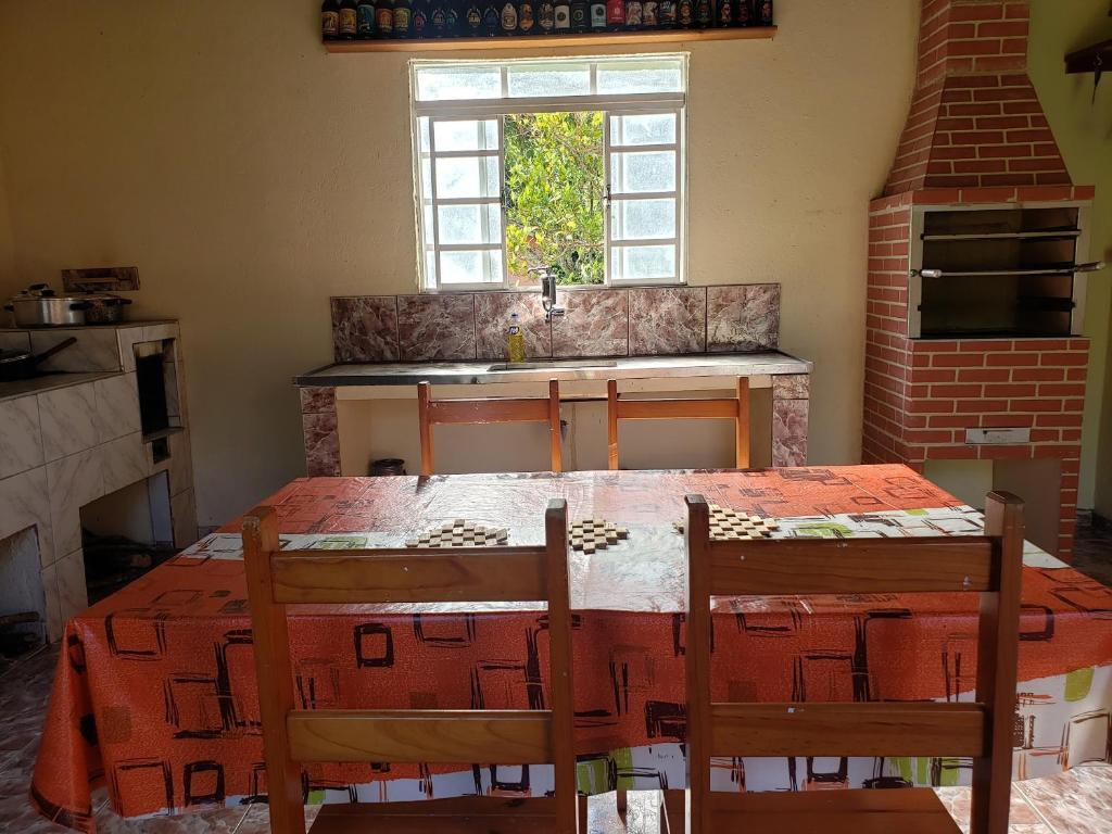 Postel nebo postele na pokoji v ubytování Chácara dos Pássaros