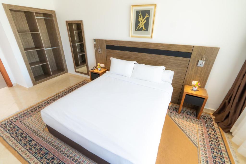 Postel nebo postele na pokoji v ubytování Tanger Med Hotel, Conference & Catering