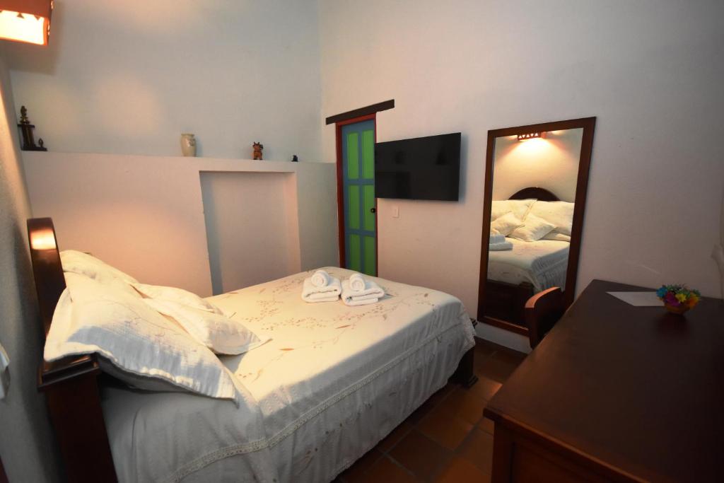 Postel nebo postele na pokoji v ubytování Casona 1865