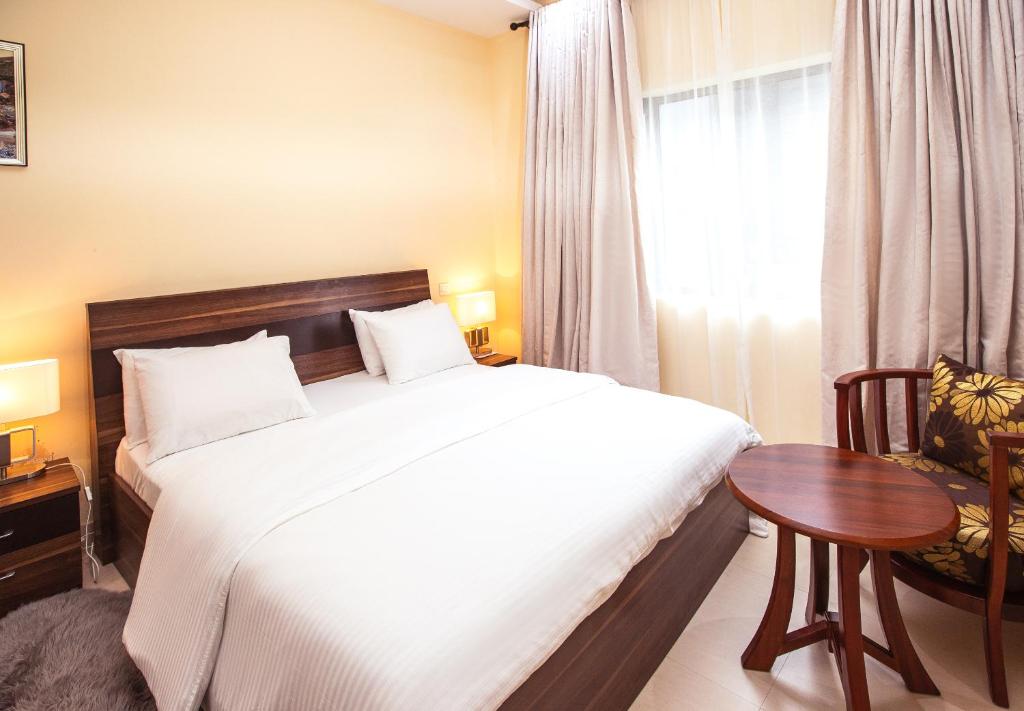 Postel nebo postele na pokoji v ubytování Rushmore - Premier 1 Room