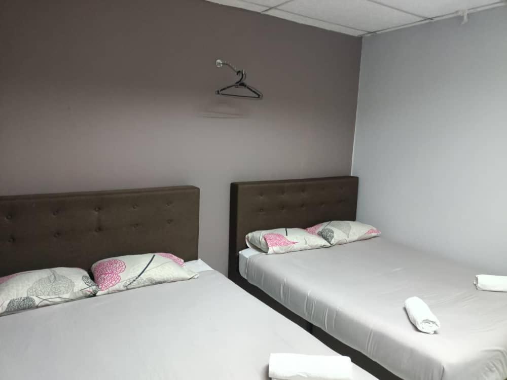 Postel nebo postele na pokoji v ubytování Hotel Tropicanna Pulai Point