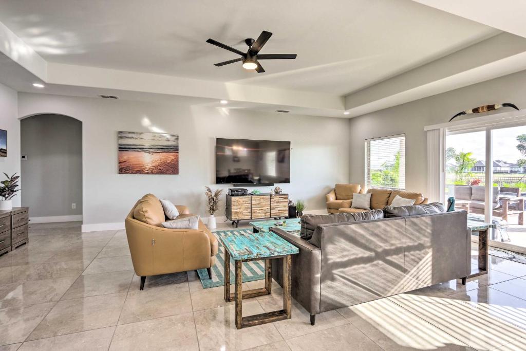 a living room with a couch and a table at Stunning Laguna Vista Retreat with Pool and Grill in Laguna Vista
