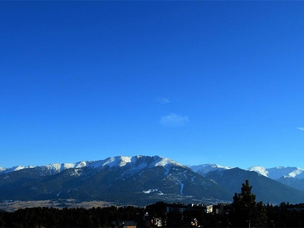 a view of a mountain range with snow covered mountains at Studio Bolquère-Pyrénées 2000, 1 pièce, 4 personnes - FR-1-592-14 in Bolquere Pyrenees 2000