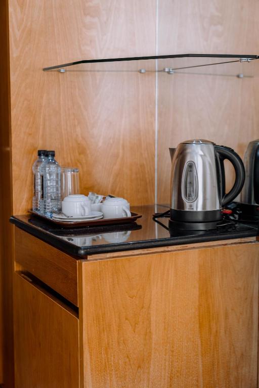 Kuchyň nebo kuchyňský kout v ubytování Saab Royale Hotel