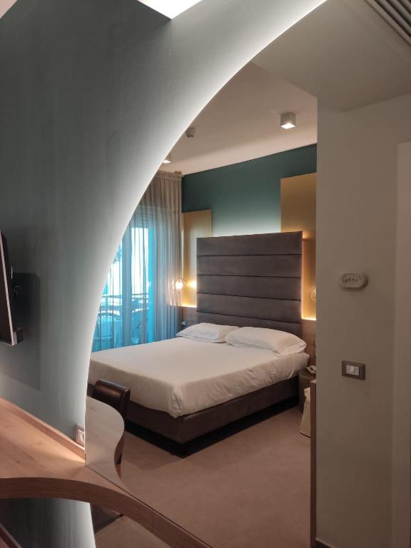 Postel nebo postele na pokoji v ubytování Park Hotel Morigi Garden & Spa