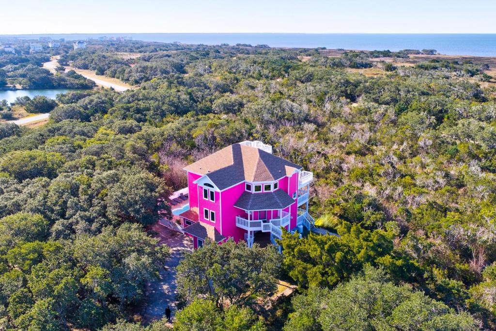 an overhead view of a pink house in the forest at The Pink Flamingo in Avon