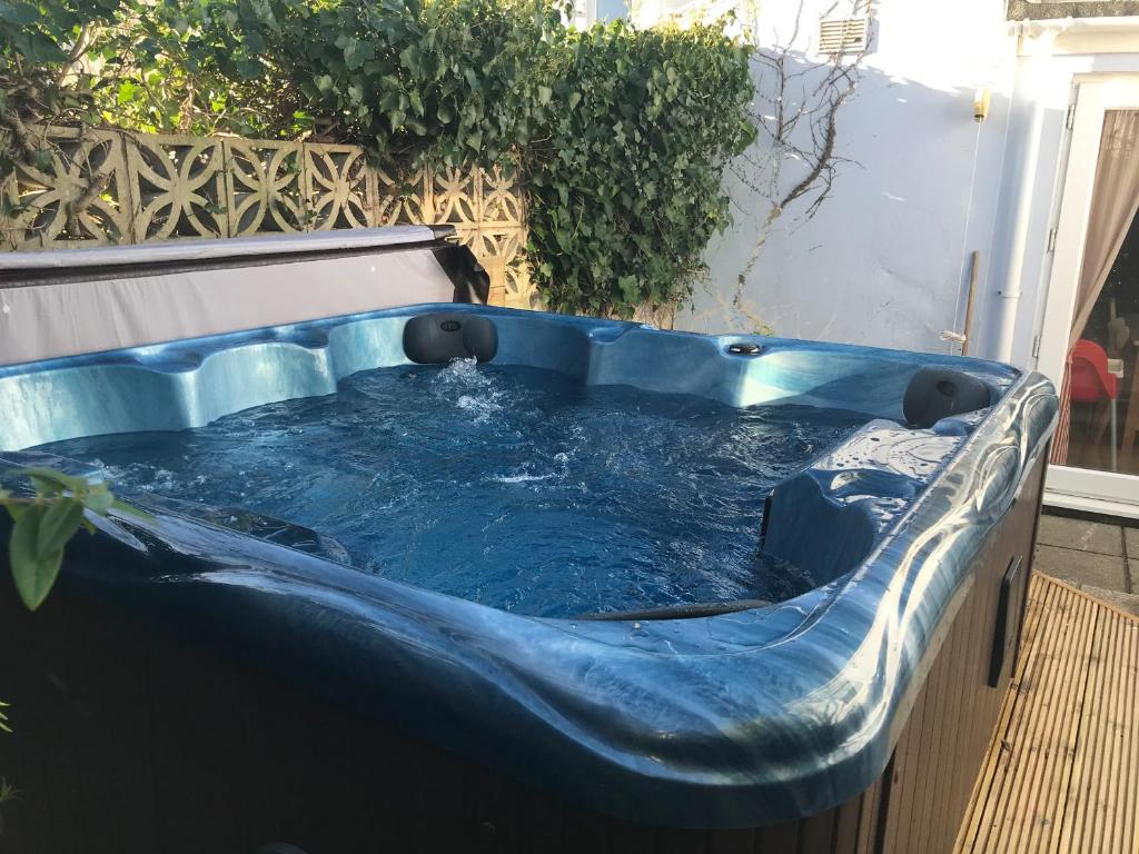 a blue hot tub sitting on a deck at Pebble Reef in Portland