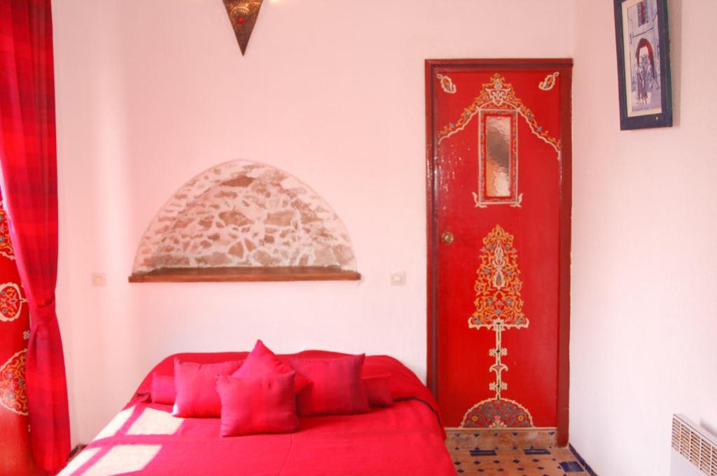 Postel nebo postele na pokoji v ubytování Riad Le Grand Large
