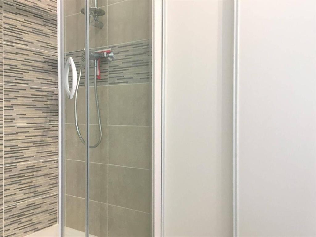 a shower with a glass door in a bathroom at Appartement Saint-Jean-de-Luz, 2 pièces, 4 personnes - FR-1-4-586 in Saint-Jean-de-Luz