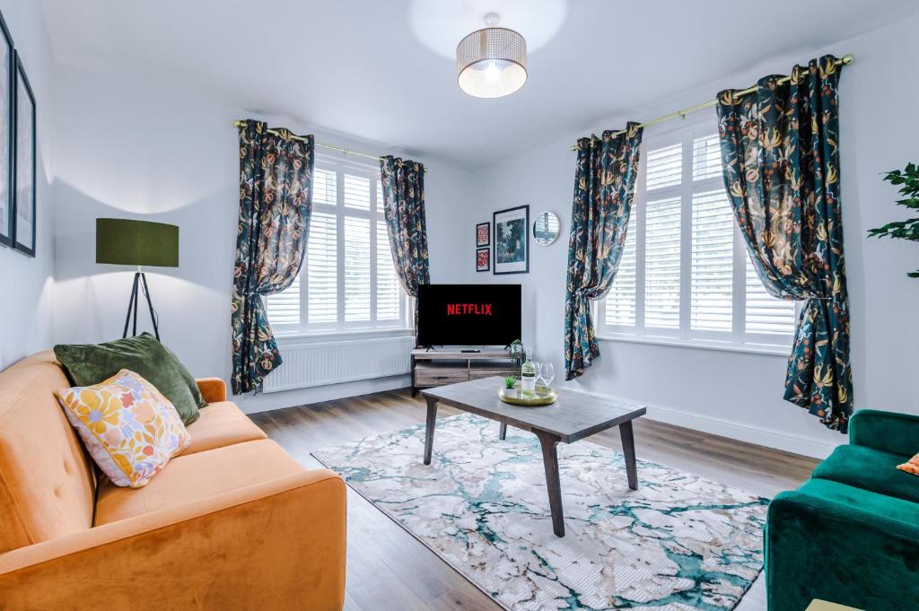 a living room with a couch and a table at Parkview Place Serviced Apartment in Coventry