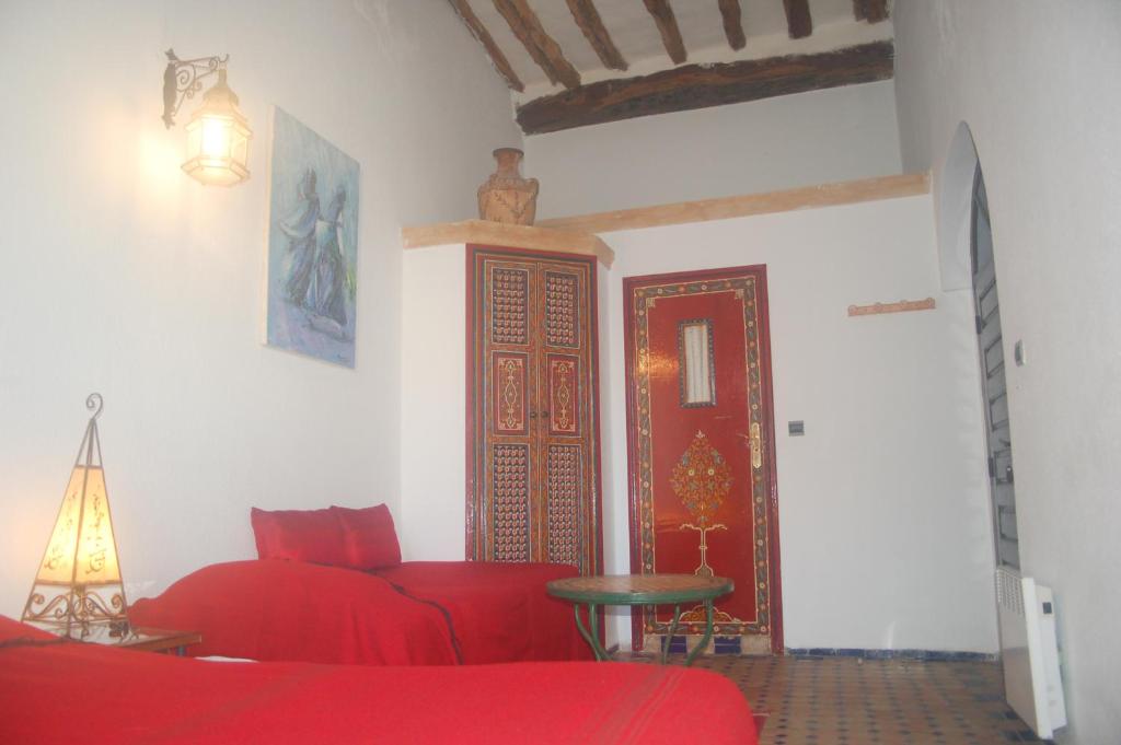 Postel nebo postele na pokoji v ubytování Riad Le Grand Large