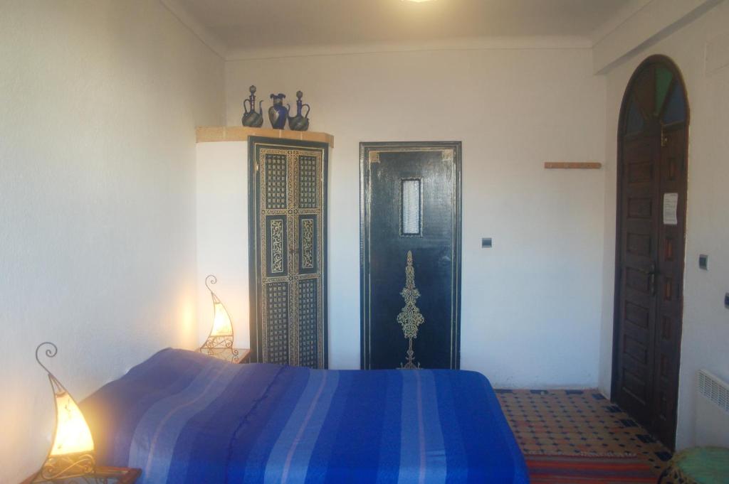 Postel nebo postele na pokoji v ubytování Riad Le Grand Large