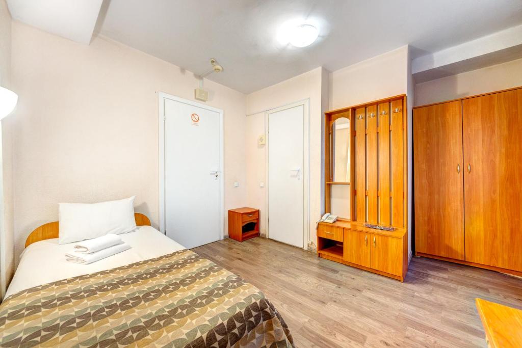 Letto o letti in una camera di Holosiyvsky Hotel