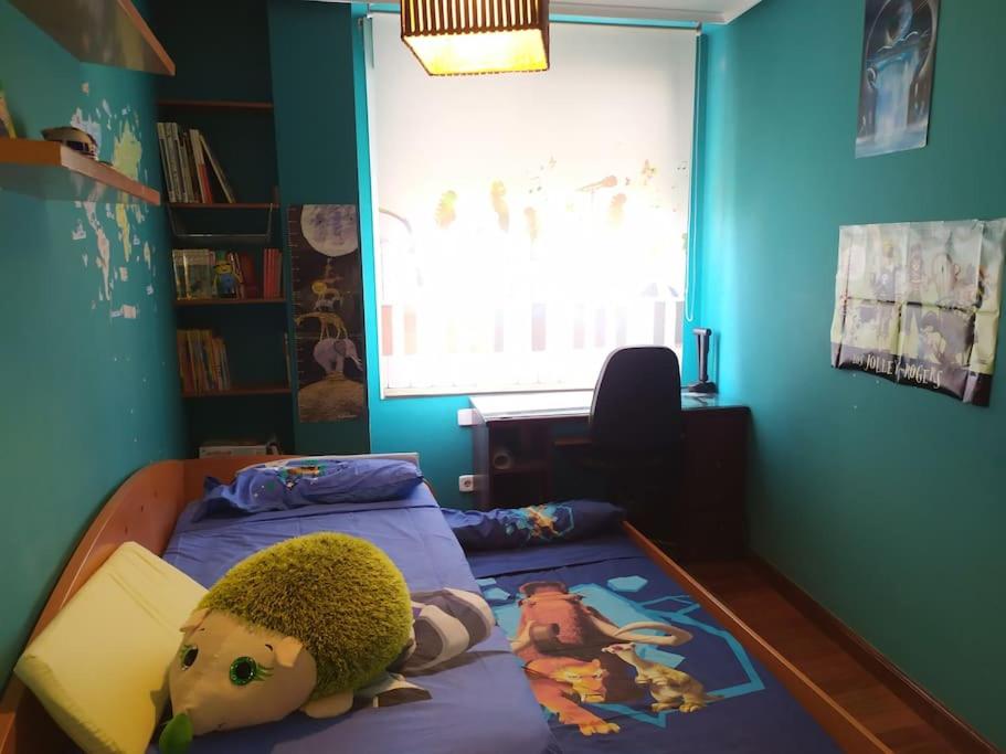 Postel nebo postele na pokoji v ubytování TUS VACACIONES EN SANTANDER