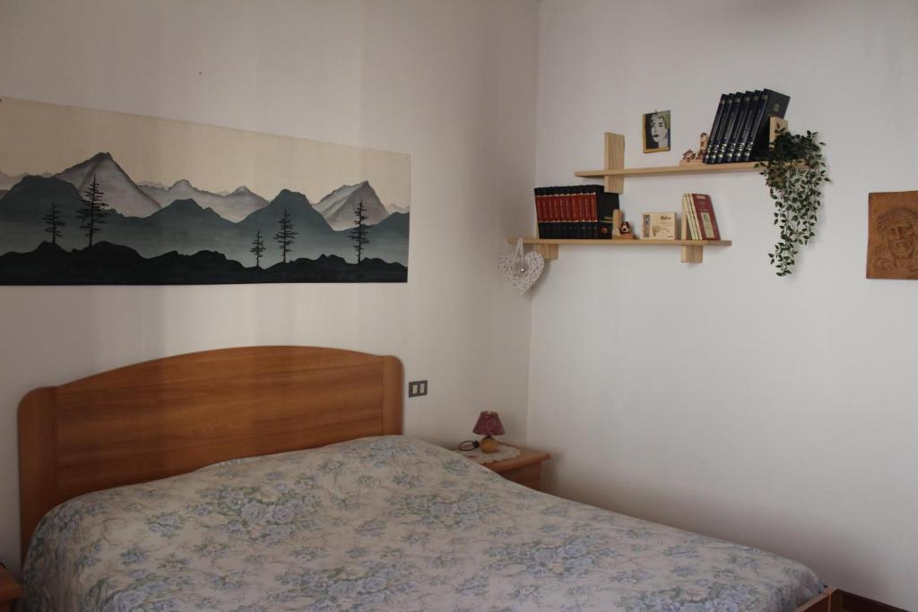 Postel nebo postele na pokoji v ubytování Apartments Carisolo - Val Rendena