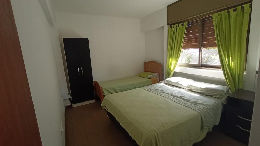 Departamento Céntrico de 1 dormitorio tesisinde bir odada yatak veya yataklar