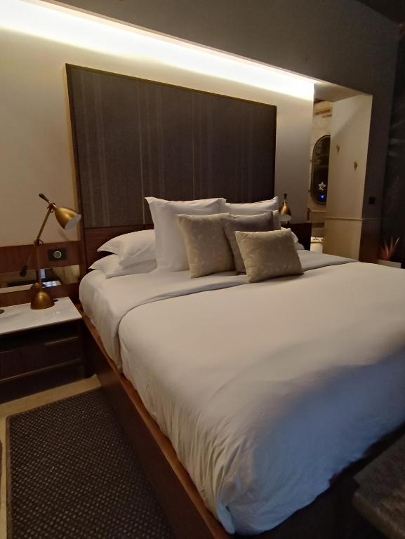 Postel nebo postele na pokoji v ubytování Hotel Casona del Porvenir