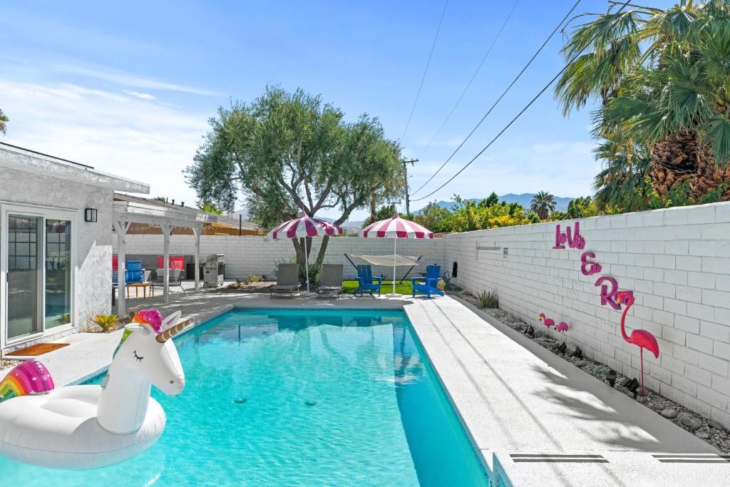 a swimming pool with a unicorn in a house at La Vie en Rose Permit# 3901 in Palm Springs