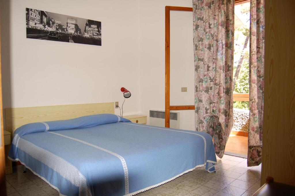 Кровать или кровати в номере Girino II