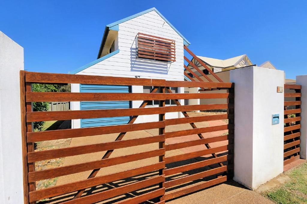 a wooden fence in front of a house at 41 Miller Street in Bargara