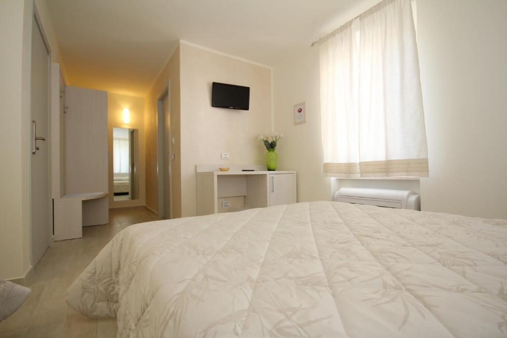 Un pat sau paturi într-o cameră la Affittacamere le Tre Sorelle