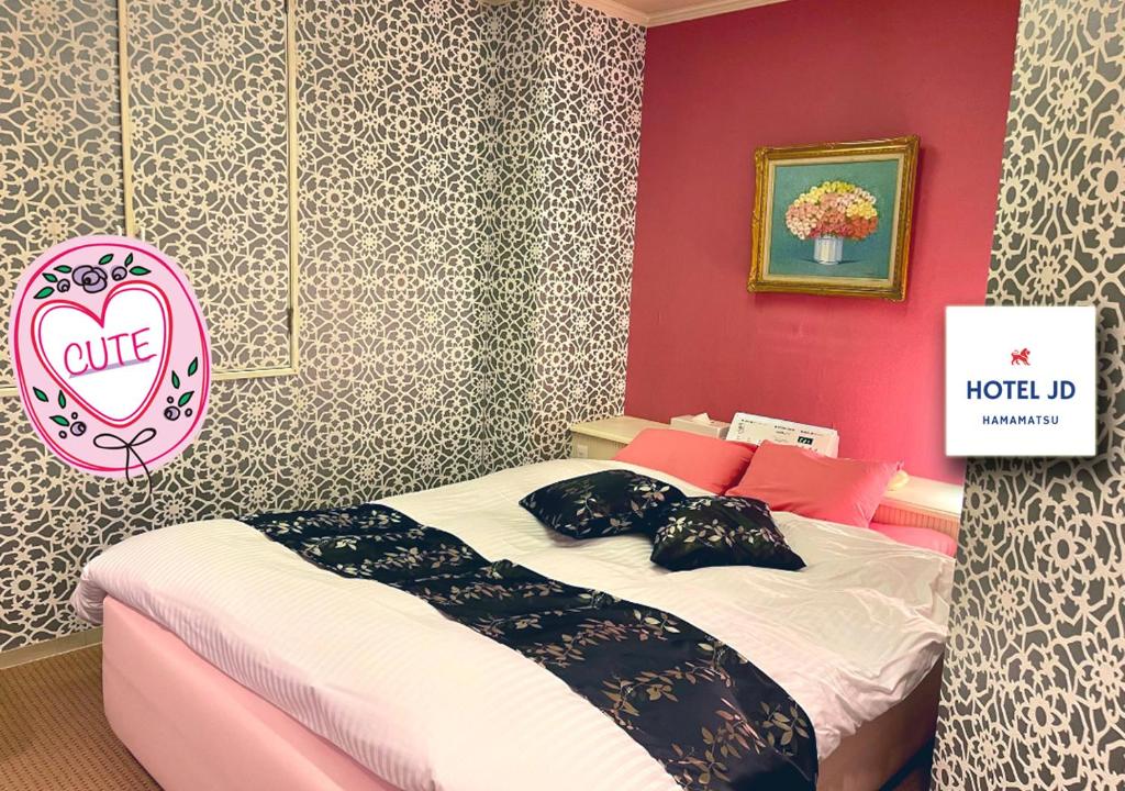 Кровать или кровати в номере Hotel JD Hamamatsu (Adult Only)