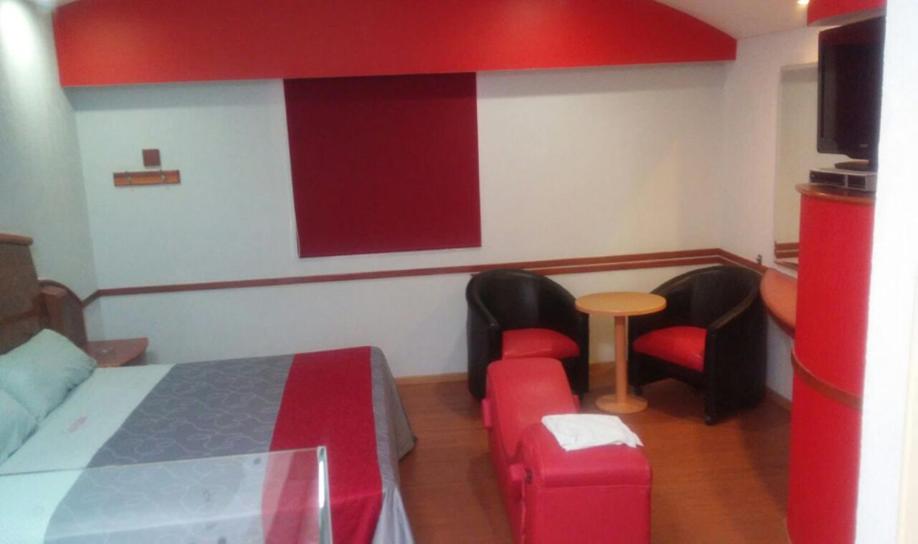 Postel nebo postele na pokoji v ubytování Auto Hotel CASA GRANDE