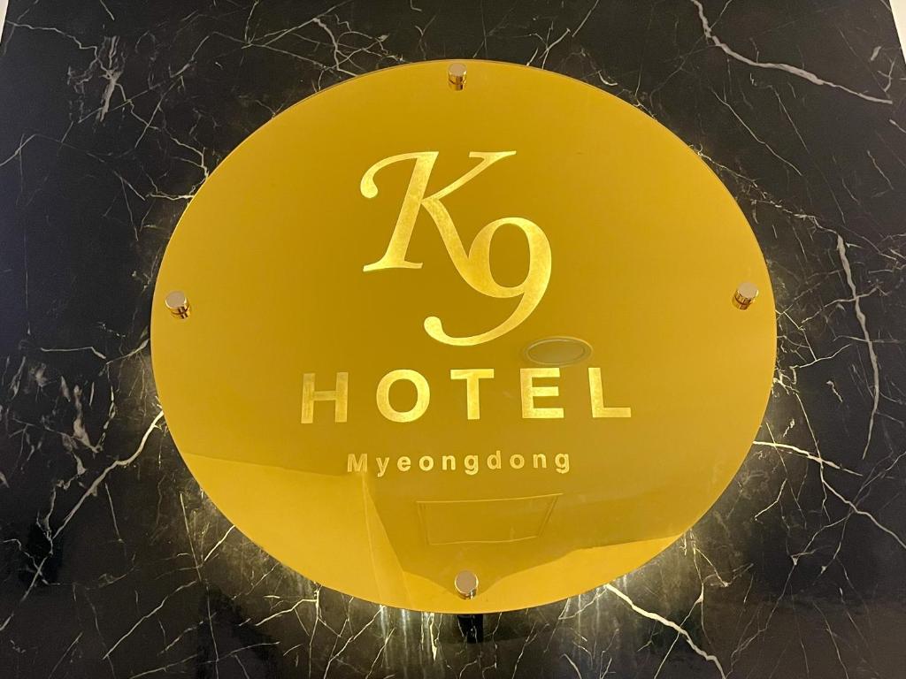 a sign for a hotel on display at a store at K9 Myeongdong Hotel in Seoul