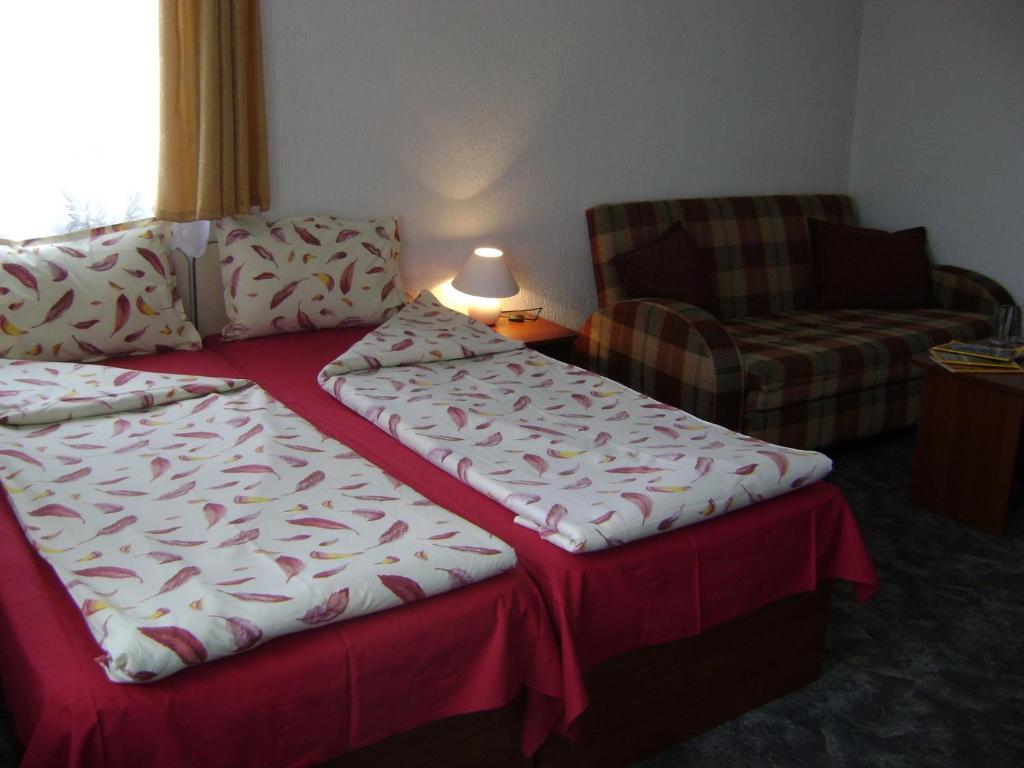 Postel nebo postele na pokoji v ubytování Michel Hotel
