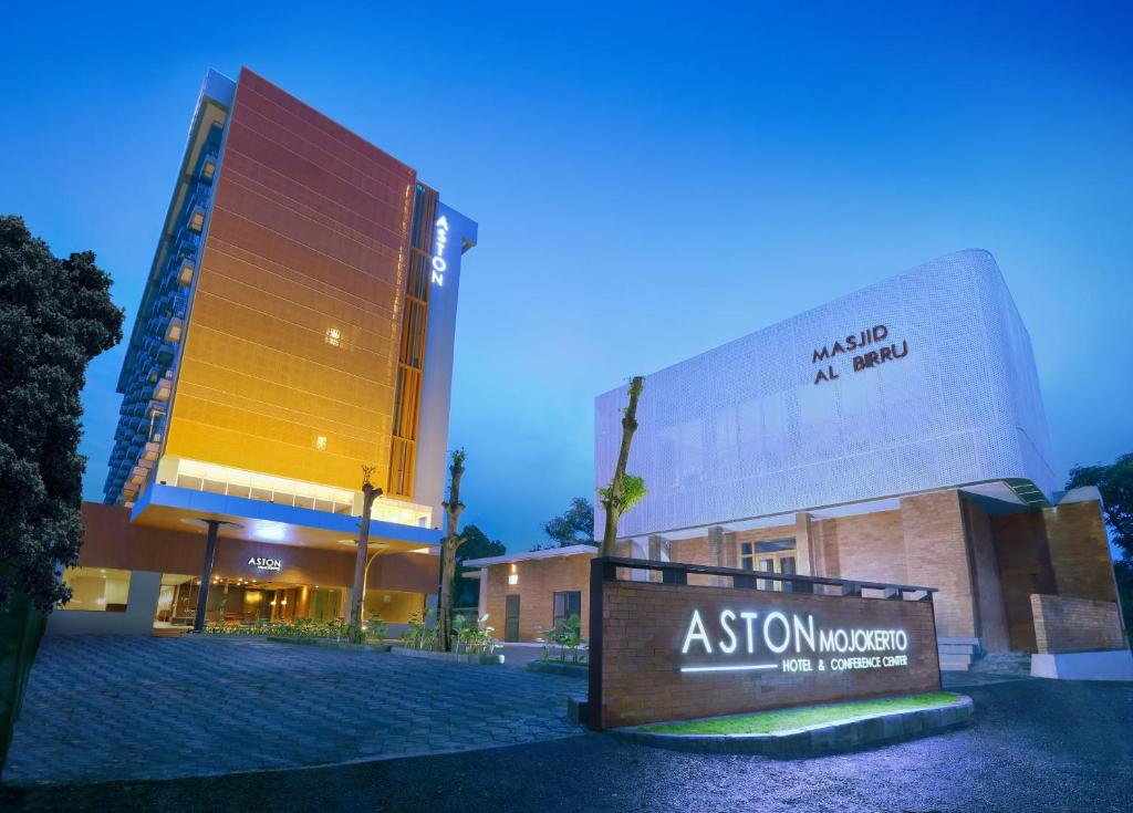 a group of buildings with a sign in front at ASTON Mojokerto Hotel & Conference Center in Mojokerto