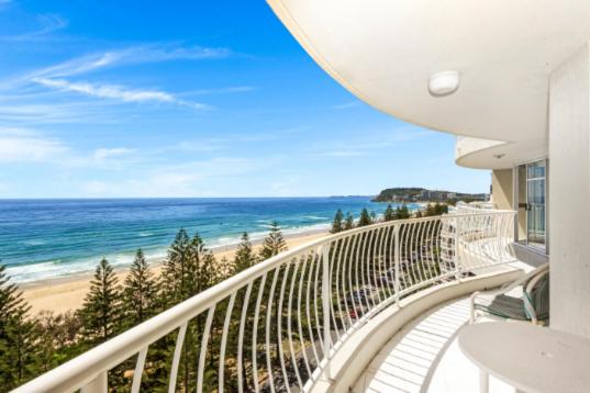 a balcony with a view of a beach and the ocean at Burleigh Surf - Hosted by Burleigh Letting in Gold Coast