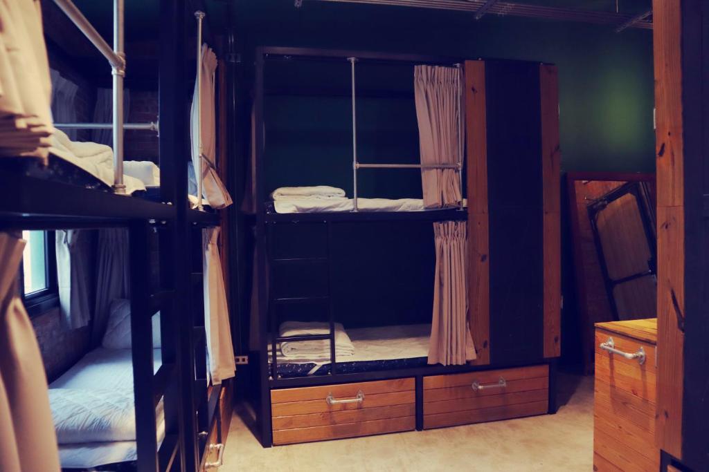 Postel nebo postele na pokoji v ubytování 旅充人文 Travel Charger Hostel