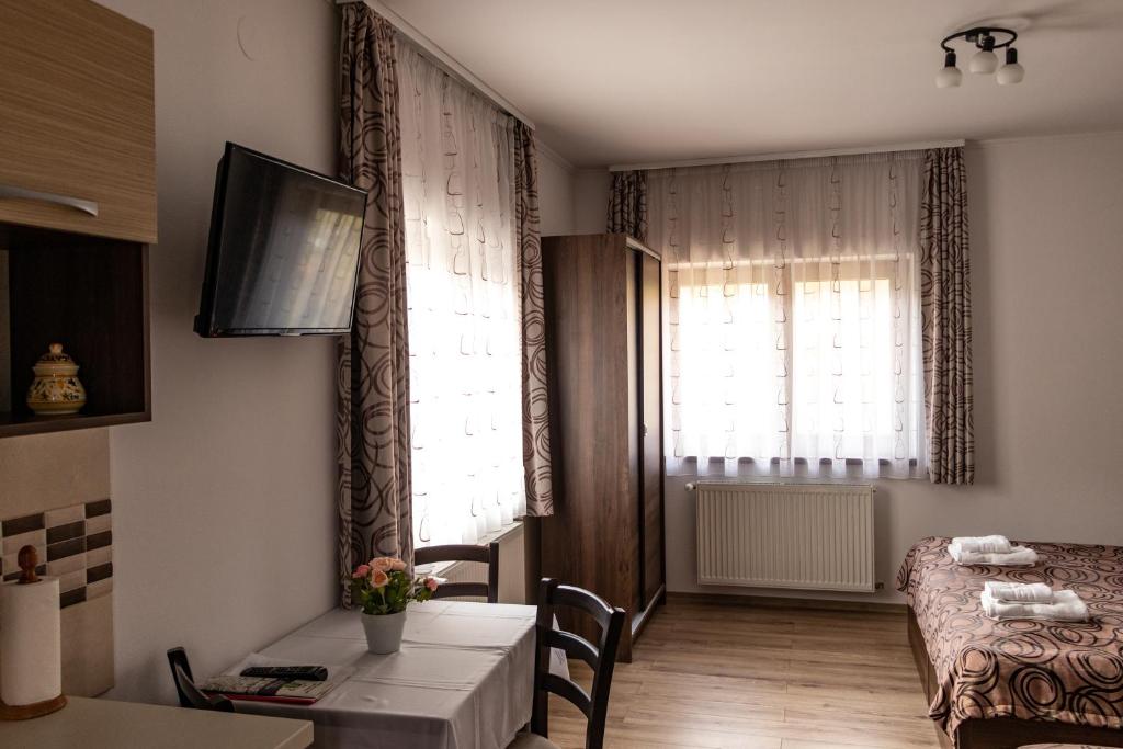 Postel nebo postele na pokoji v ubytování Casa Tofi Vendégház