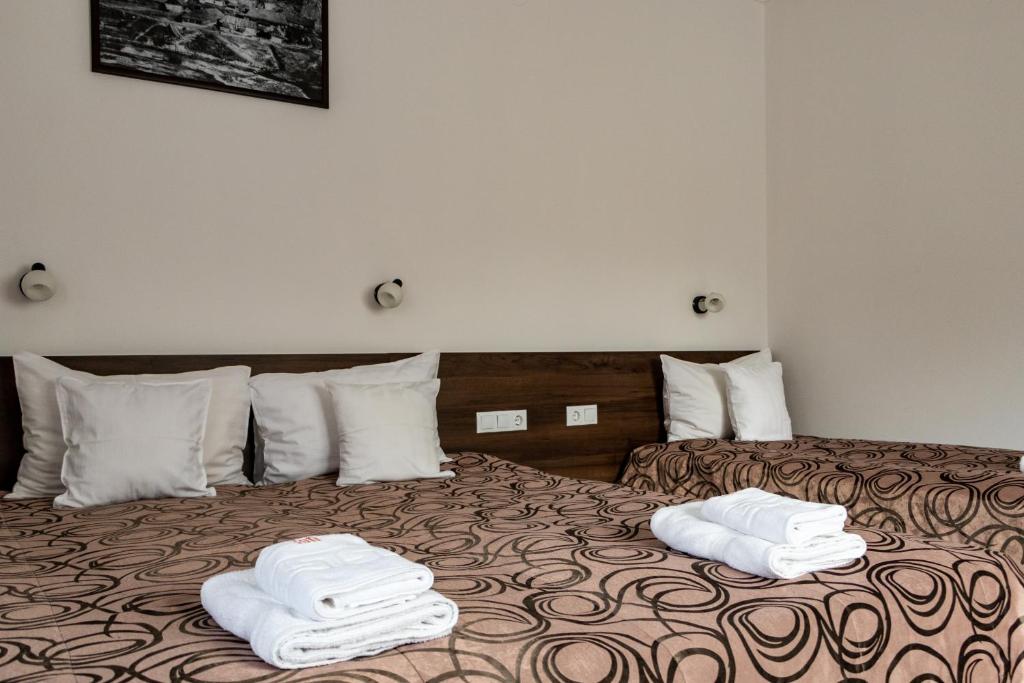 Postel nebo postele na pokoji v ubytování Casa Tofi Vendégház