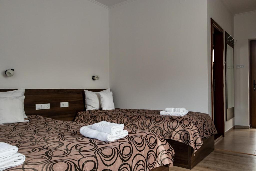 Postel nebo postele na pokoji v ubytování Casa Tofi Vendégház