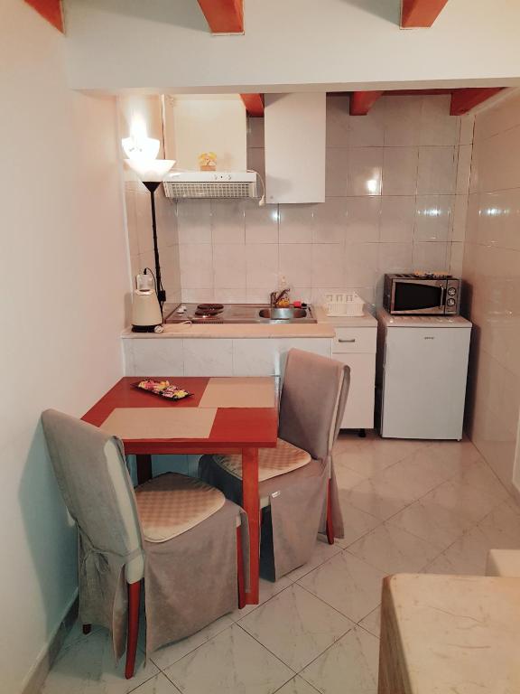 Kuchyň nebo kuchyňský kout v ubytování Apartments Minerva