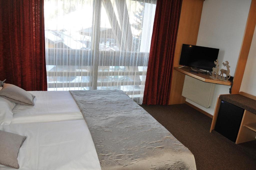 Letto o letti in una camera di Residence Anda