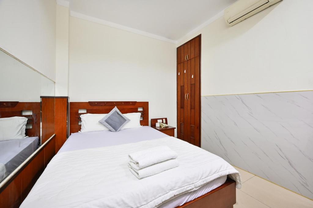 Giường trong phòng chung tại An Binh 2 hotel near Dam Sen Park