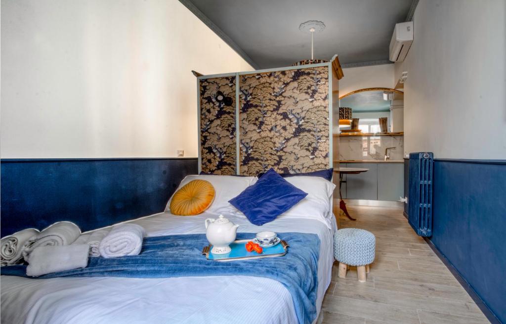 Posteľ alebo postele v izbe v ubytovaní Rasella44, Blu Apartment
