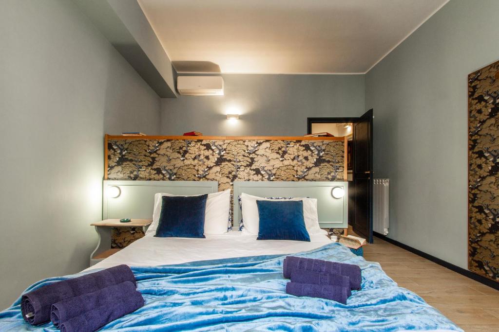 Posteľ alebo postele v izbe v ubytovaní Rasella44, Blu Apartment