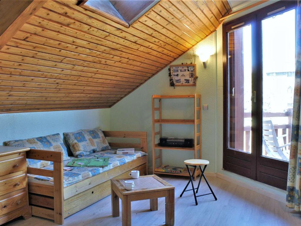 a bedroom with a bed and a wooden ceiling at Appartement 2 pièces, 4 couchages à Risoul 1850 - FR-1-330-39 in Risoul