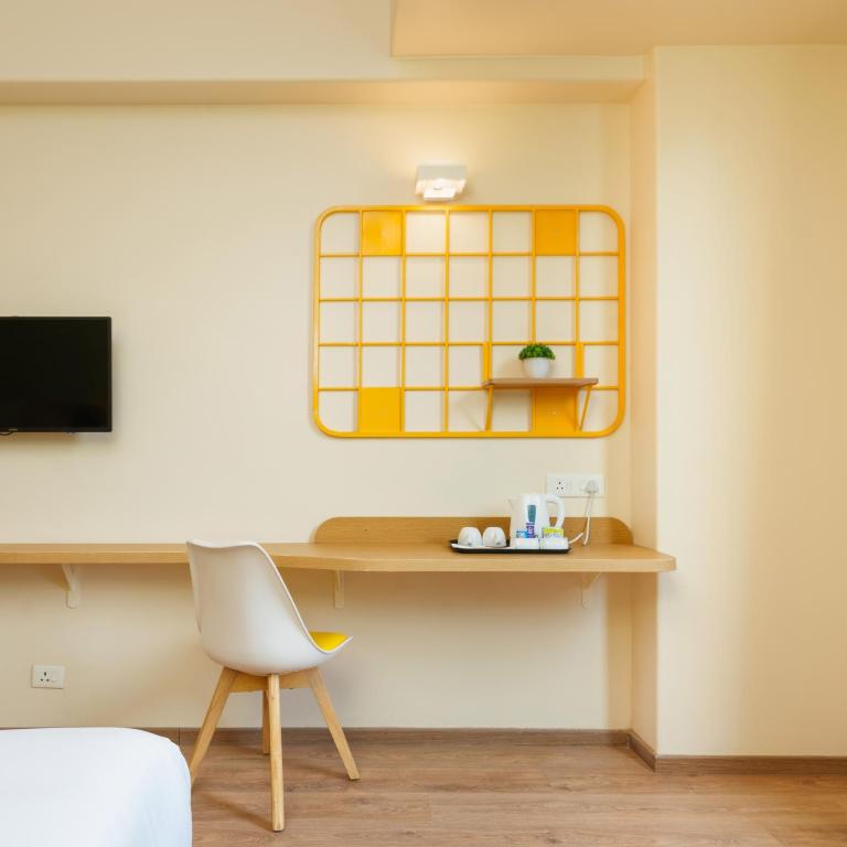 TV a/nebo společenská místnost v ubytování Bloom Hotel - Sector 62