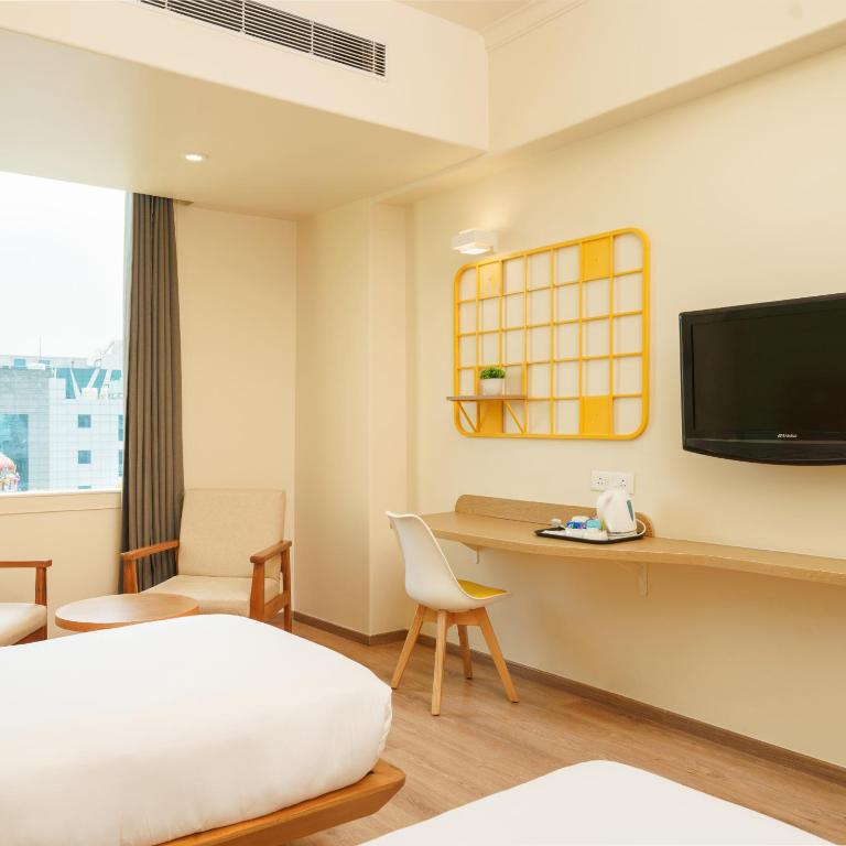TV a/nebo společenská místnost v ubytování Bloom Hotel - Sector 62