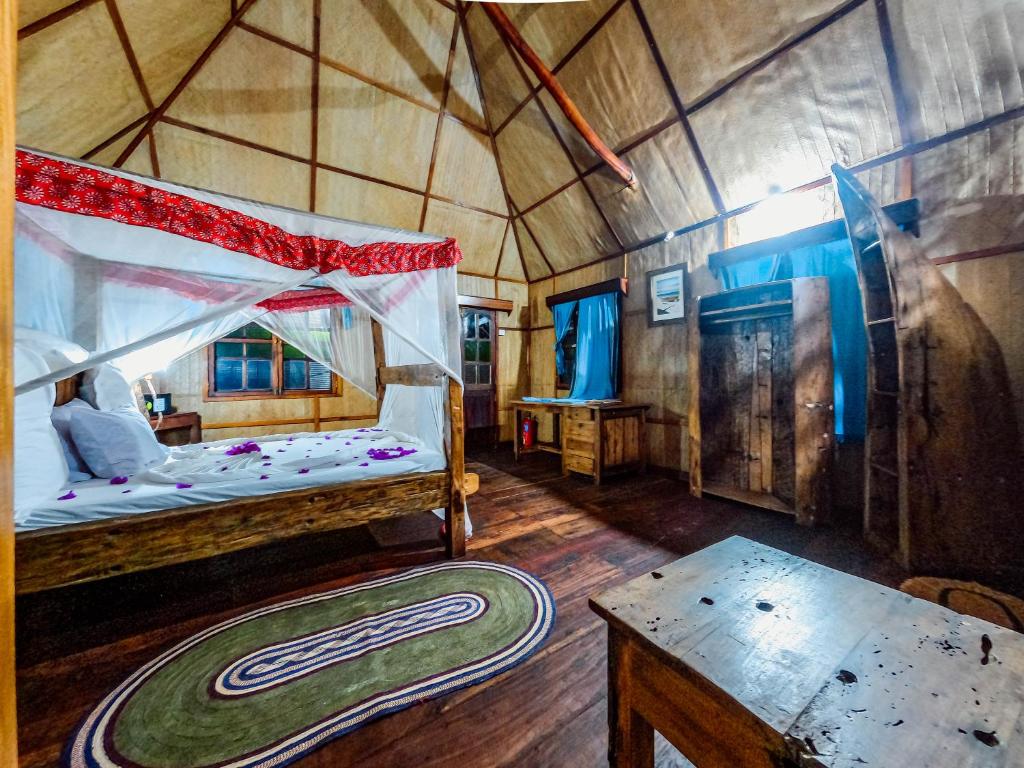 Postel nebo postele na pokoji v ubytování Pemba Eco Lodge