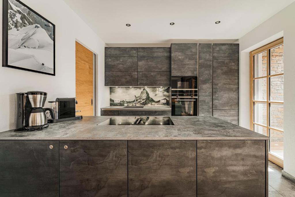 Kuchyň nebo kuchyňský kout v ubytování Dachstein West Apartment T3