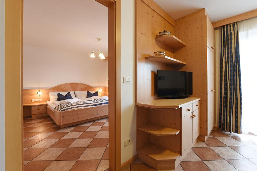 Postel nebo postele na pokoji v ubytování Alpin-Residence Amadeus