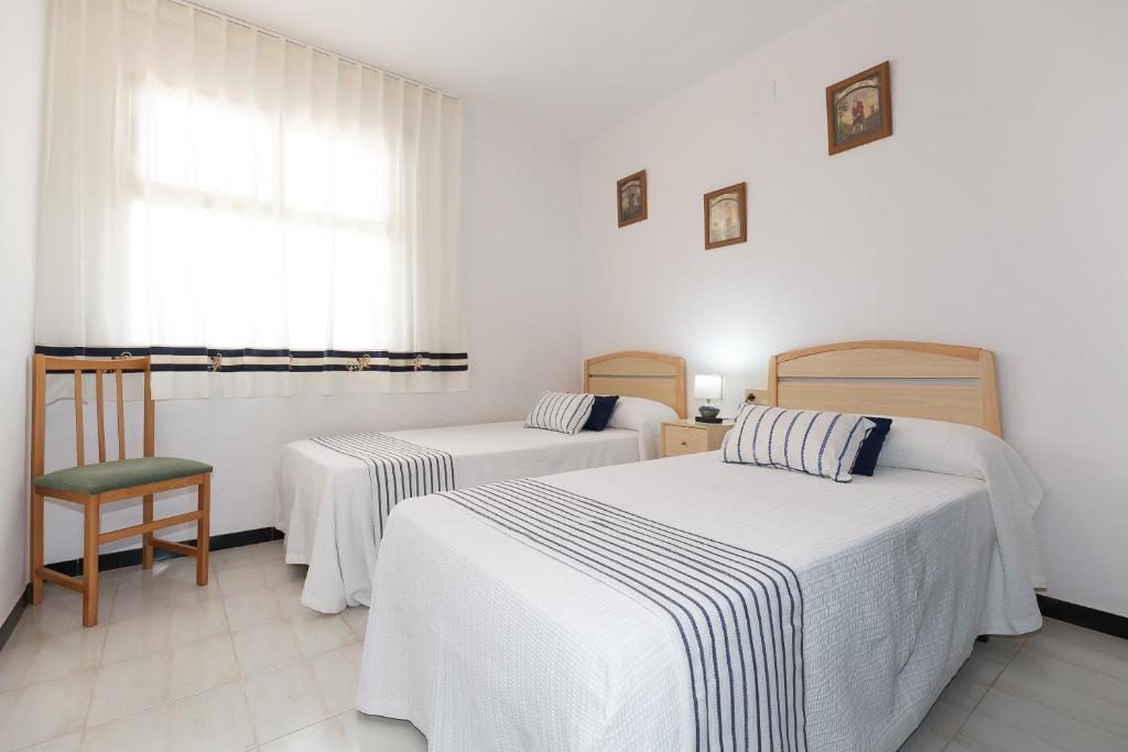 Postel nebo postele na pokoji v ubytování UHC Los Flamencos Family Apartments