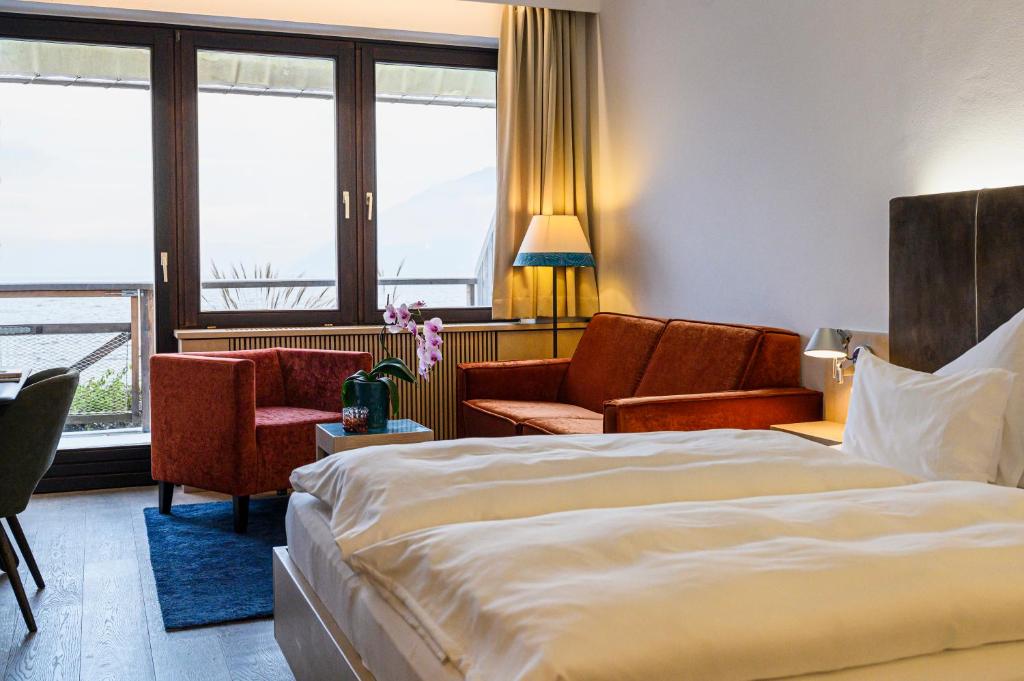Postel nebo postele na pokoji v ubytování Das Traunsee - Das Hotel zum See 4 Stern Superior